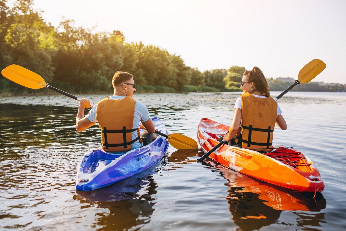 couple-together-kayaking-river