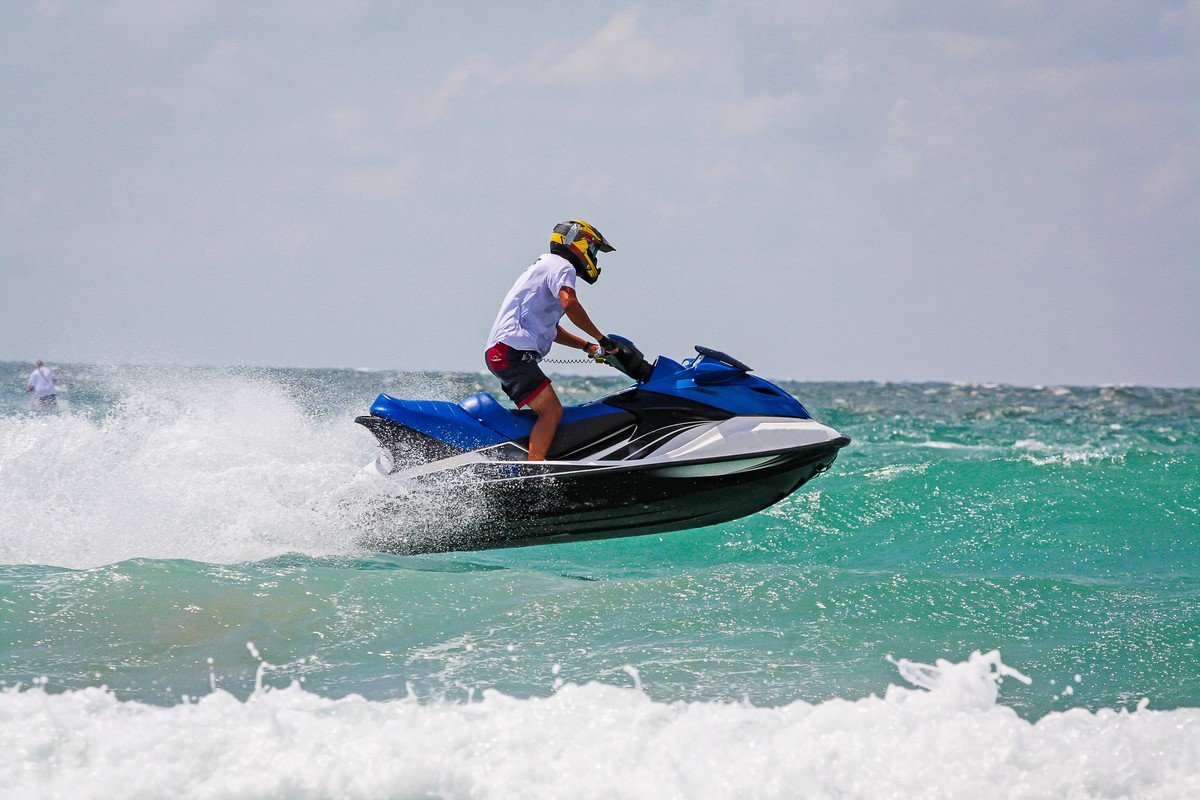 young-man-professional-jet-ski-rider-performs-many-tricks-waves